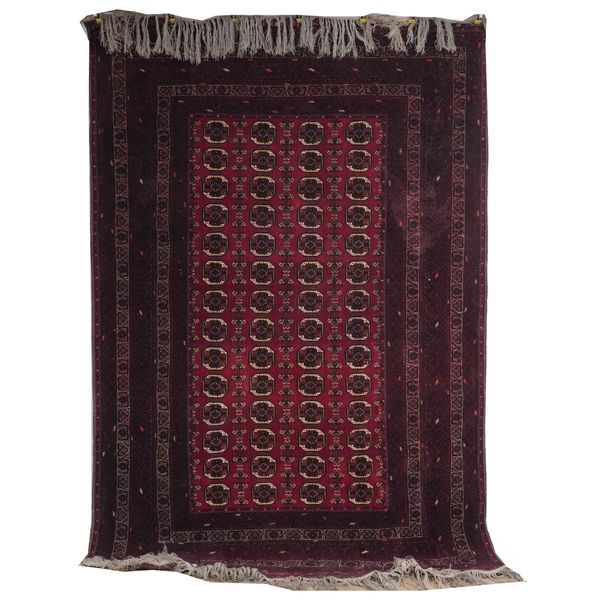 AN AFGHAN CARPET OF TURKMAN DESIGN