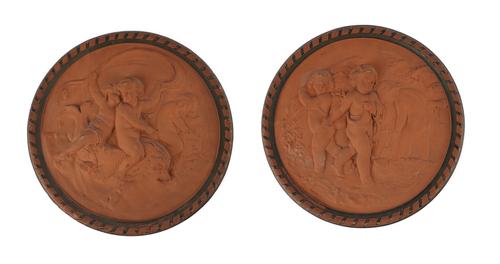 A PAIR OF TERRACOTTA RELIEF CAST ROUNDELS DEPICTING PUTTI AT PLAY AND LABOUR (2)
