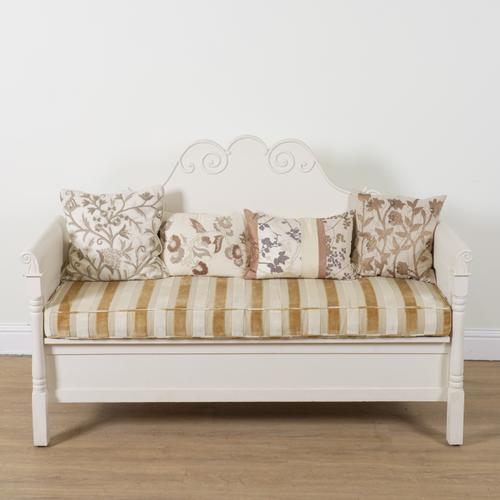A MODERN CREAM PAINTED SHAPED BACK BOX SEAT SETTLE