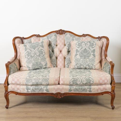A LOUIS XV STYLE CARVED AND STAINED BEECH FRAMED BUTTON BACK SOFA