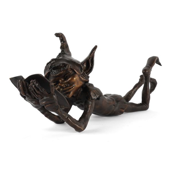IN THE MANNER OF DAVID GOODE: A PATINATED BRONZE FIGURE OF A GOBLIN READING