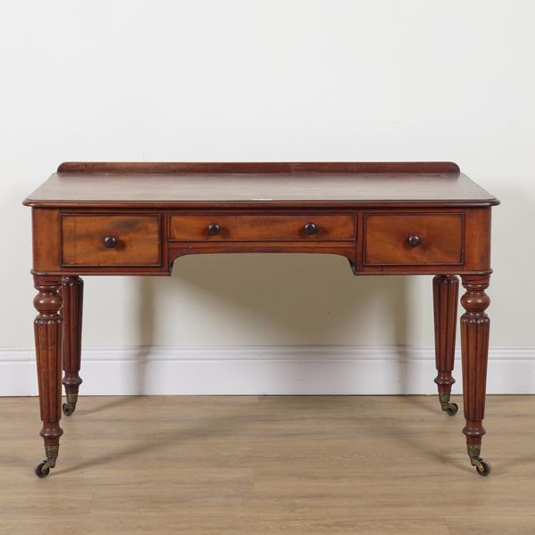 A LATE REGENCY MAHOGANY WRITING DESK