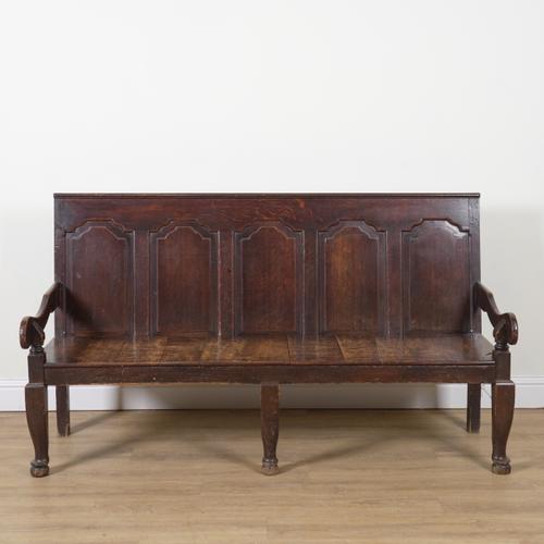 AN 18TH CENTURY OAK FIVE PANEL BACK OPEN ARM SETTLE