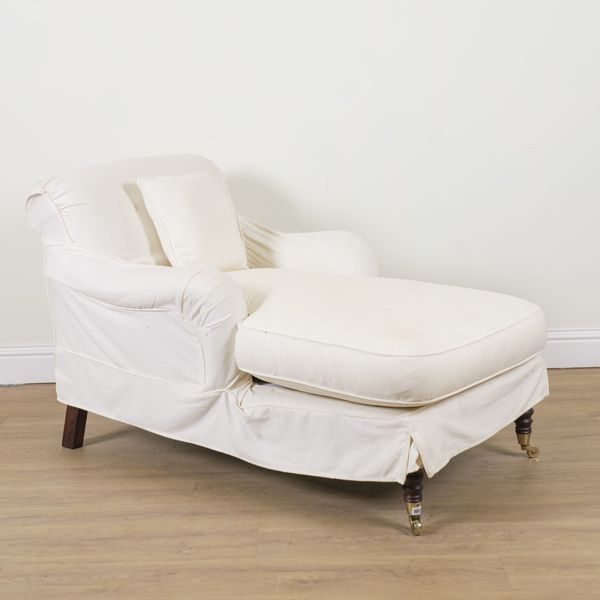 A CREAM UPHOLSTERED WING BACK CHAISE LONGUE