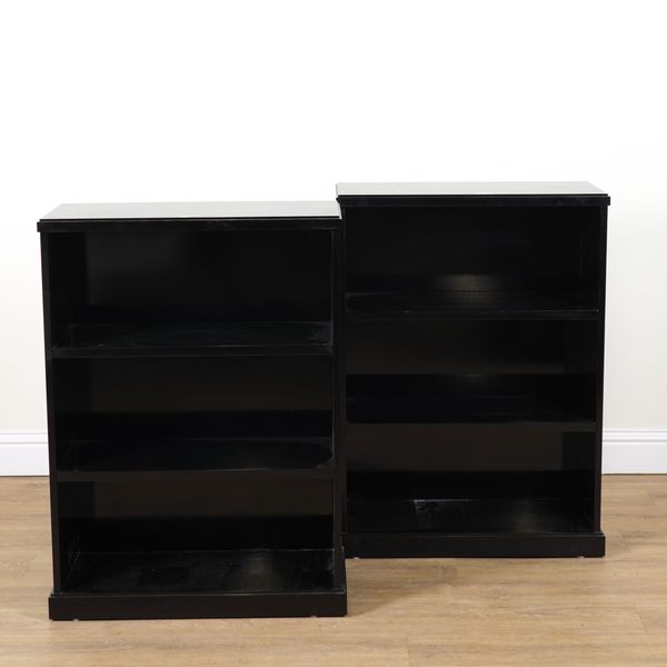 A PAIR OF MODERN EBONISED FLOOR STANDING THREE TIER OPEN BOOKCASES (2)