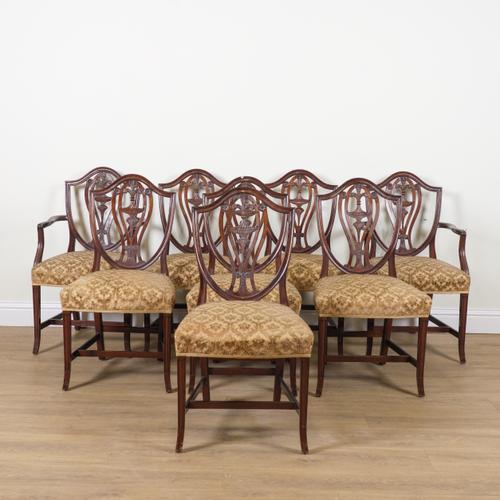 A SET OF EIGHT GEORGE III STYLE MAHOGANY FRAMED SHIELD BACK DINING CHAIRS (8)