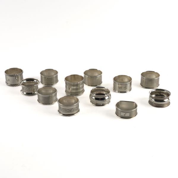 TWELVE SILVER NAPKIN RINGS (12)