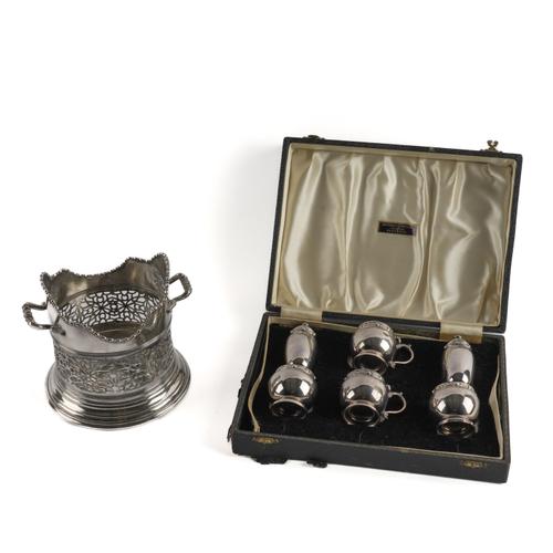 A SILVER SIX PIECE CONDIMENT SET AND A PLATED TWIN HANDLED BOTTLE STAND (2)