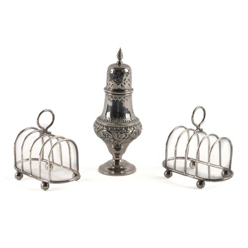 A PAIR OF SILVER TOASTRACKS AND A SILVER SUGAR CASTER (3)