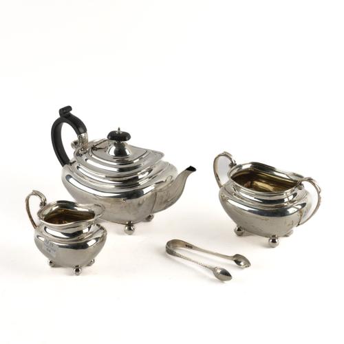 A SILVER THREE PIECE SMALL TEA SET AND A PAIR OF SILVER SUGAR TONGS (4)