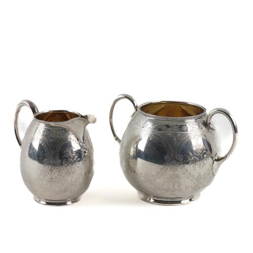 A VICTORIAN SILVER SUGAR BOWL AND A MILK JUG (2)