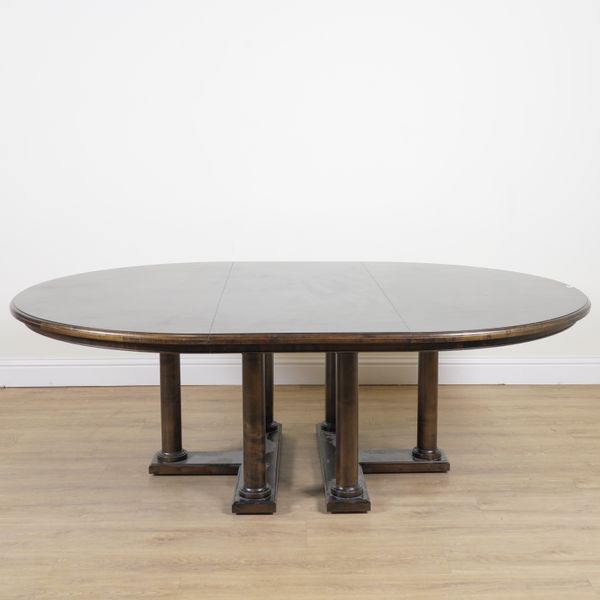 A MODERN OVAL HARDWOOD EXTENDING DINING TABLE