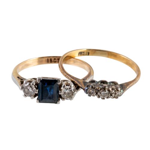 A GOLD, SAPPHIRE AND DIAMOND THREE STONE RING AND A GOLD AND DIAMOND THREE STONE RING (2)