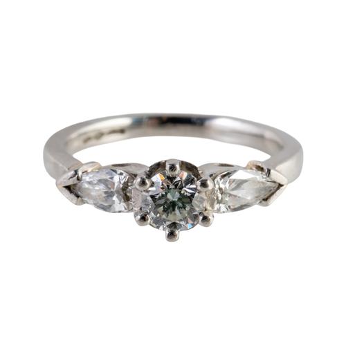 A PLATINUM AND DIAMOND THREE STONE RING