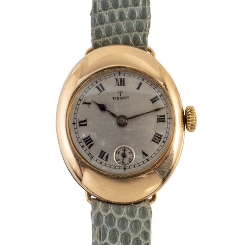 A TISSOT 18CT GOLD OVAL CASED LADY'S WRISTWATCH