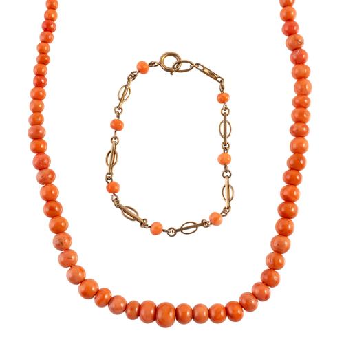 A SINGLE ROW NECKLACE OF GRADUATED CORAL BEADS AND A 9CT GOLD AND CORAL SMALL BRACELET (2)