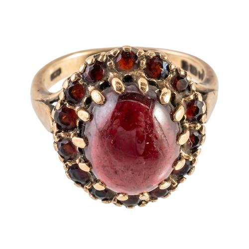 A 9CT GOLD AND GARNET CLUSTER RING