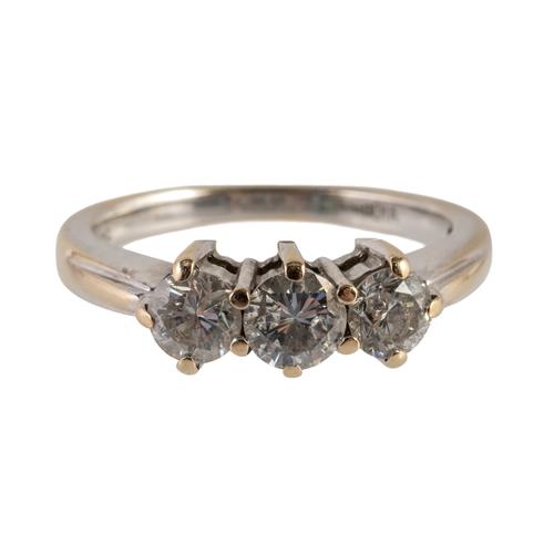 AN 18CT WHITE GOLD AND DIAMOND THREE STONE RING