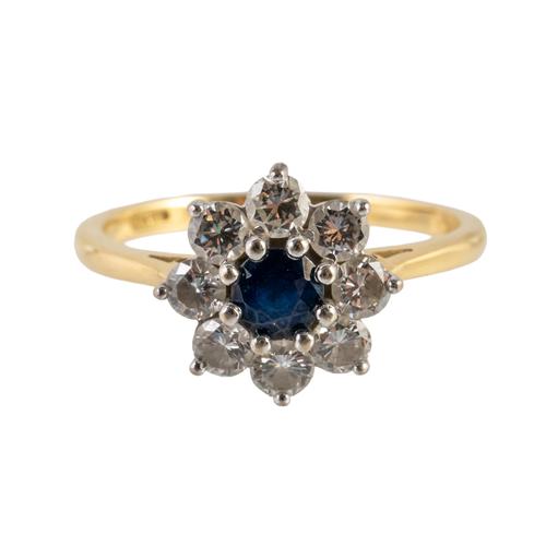 AN 18CT GOLD, SAPPHIRE AND DIAMOND NINE STONE CLUSTER RING