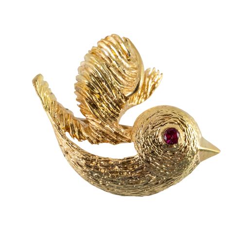 A GROSSE GOLD BROOCH