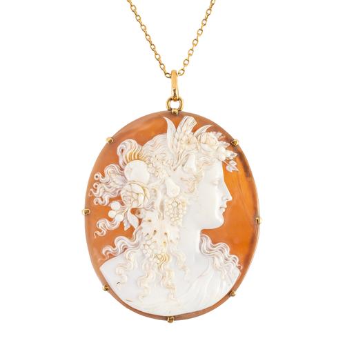 A GOLD MOUNTED OVAL SHELL CAMEO PENDANT WITH A GOLD NECKCHAIN (2)