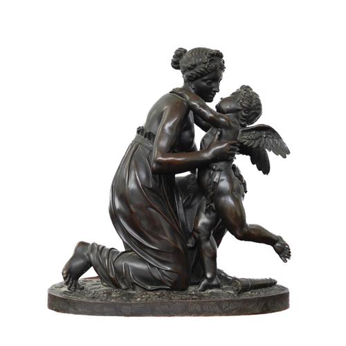 A FRENCH PATINATED BRONZE GROUP OF VENUS AND CUPID