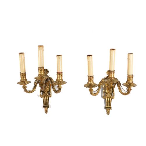 A PAIR OF REGENCE STYLE ORMOLU THREE LIGHT WALL APPLIQUES (2)