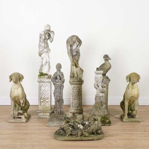 A GROUP OF TWELVE RECONSTITUTED STONE FIGURES (12)