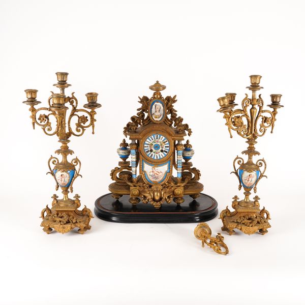 A FRENCH GILT SPELTER SEVRES STYLE BLUE GROUND CLOCK GARNITURE (3)