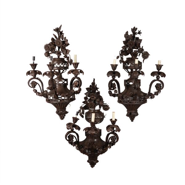 A SET OF THREE BRONZE LACQUERED SHEET METAL FLORAL WALL LIGHTS (3)