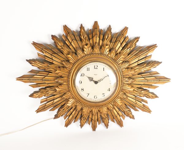 AN ENGLISH GILTWOOD ‘SUN BURST’  WALL CLOCK