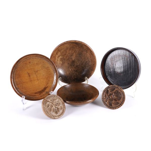 A GROUP OF TREEN INCLUDING TWO SYCAMORE DIARY BOWLS AND TWO BUTTER MOULDS OR STAMPS (6)