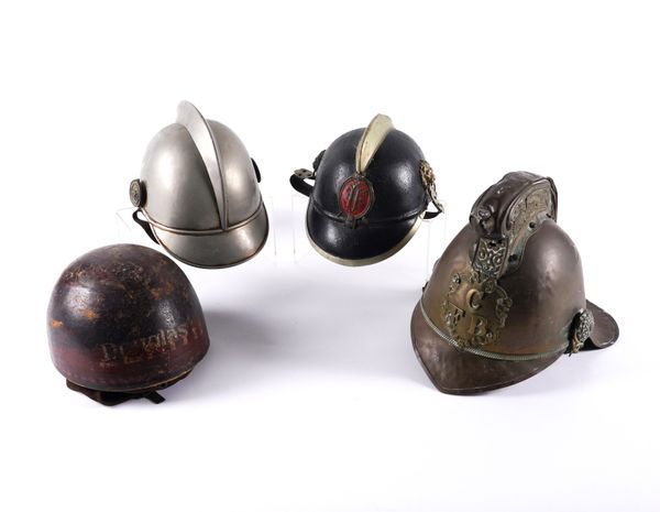 A GROUP OF FOUR VARIOUS HELMETS INCLUDING A VICTORIAN FIREMAN’S HELMET (4)