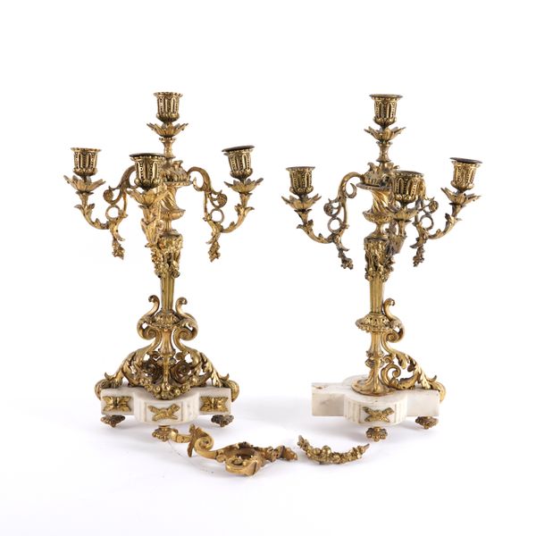 A PAIR OF FRENCH LOUIS XVI STYLE GILT-BRONZE MOUNTED WHITE MARBLE FOUR LIGHT CANDELABRA (2)