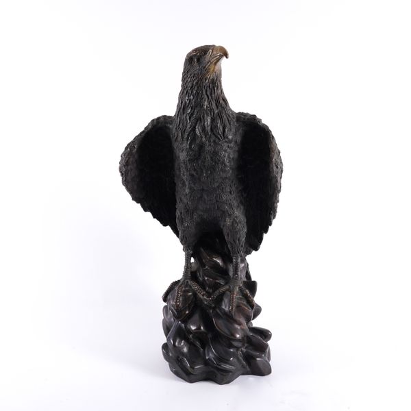 A PATINATED BRONZE MODEL OF AN EAGLE