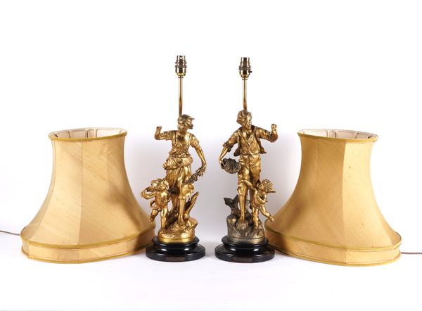 A PAIR OF FRENCH GILT-METAL FIGURAL TABLE LAMPS (2)