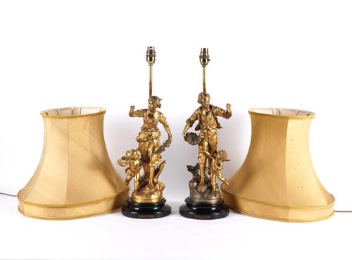 A PAIR OF FRENCH GILT-METAL FIGURAL TABLE LAMPS (2)