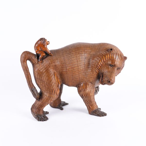 A SOUTH EAST ASIAN WICKER WORK MODEL OF A MOTHER BABOON AND BABY