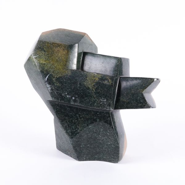 AN AFRICAN CARVED SERPENTINE STONE CUBIST STYLE HEAD