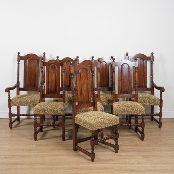 A SET OF EIGHT 17TH CENTURY STYLE OAK ARCH PANEL BACK DINING CHAIRS (8)