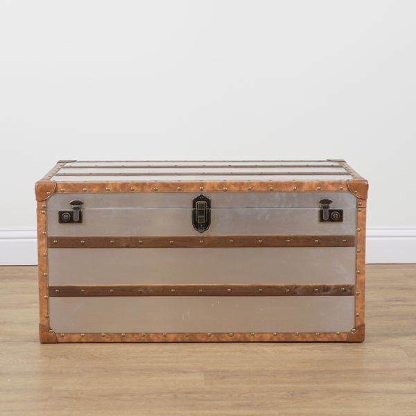 A MODERN LEATHER BOUND BRUSHED STEEL STEAMER TRUNK