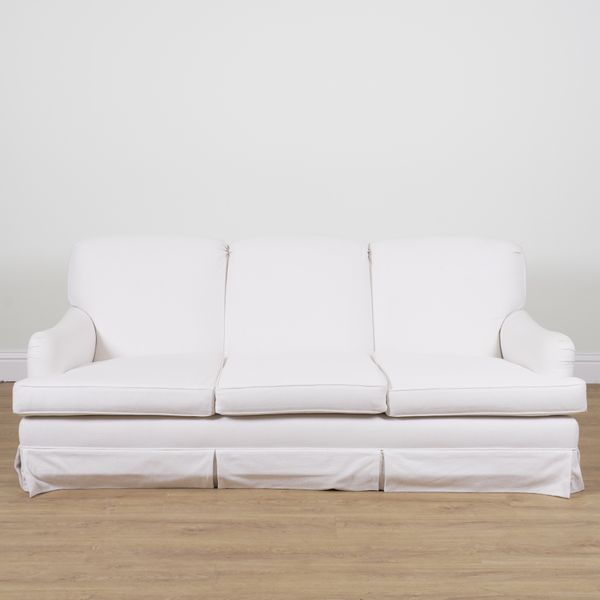 A MODERN WHITE UPHOLSTERED THREE SEAT SOFA