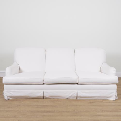A MODERN WHITE UPHOLSTERED THREE SEAT SOFA