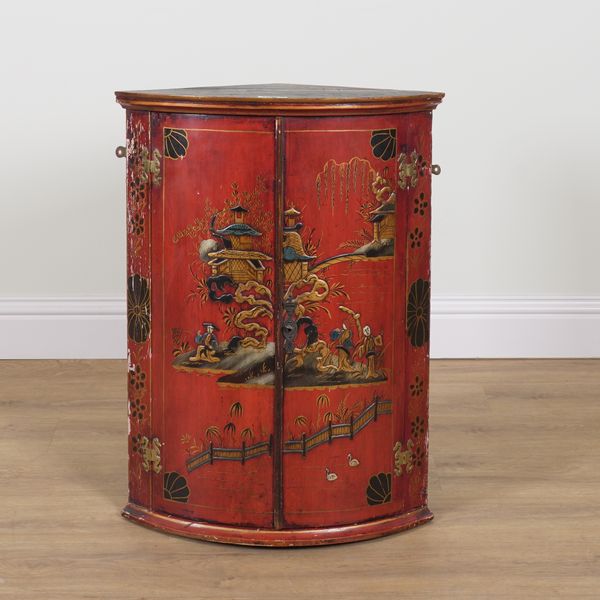 AN EDWARDIAN RED LACQUER CHINOSERIE DECORATED CORNER CUPBOARD