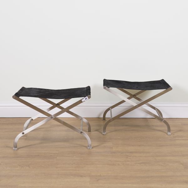 FLEXFORM; A PAIR OF CHROME AND HIDE FOLDING X-FRAME STOOLS (2)