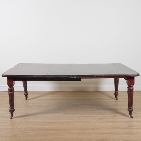 A VICTORIAN MAHOGANY EXTENDING DINING TABLE