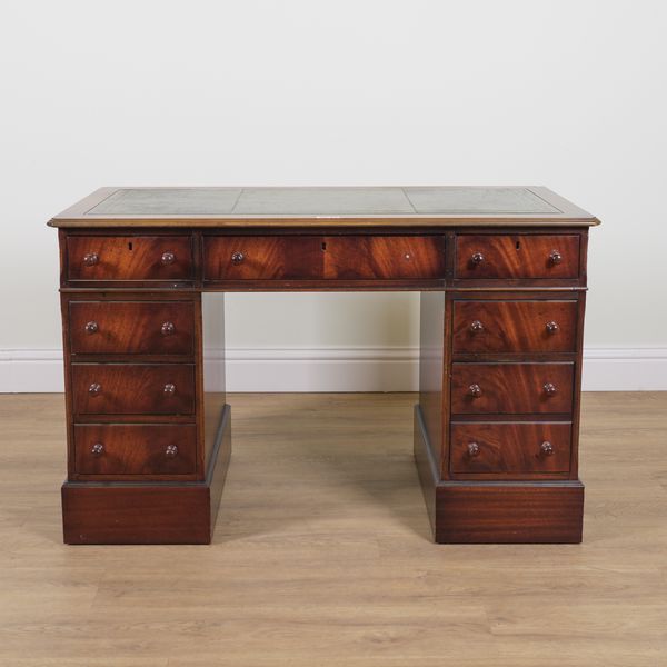 A 20TH CENTURY MAHOGANY NINE DRAWER PEDESTAL DESK