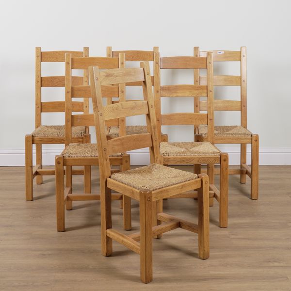 A SET OF SIX OAK FRAMED LADDER BACK DINING CHAIRS (6)