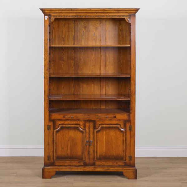 AN 18TH CENTURY STYLE OAK BOOKCASE CABINET