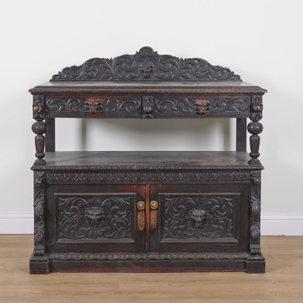 A 17TH CENTURY STYLE CARVED OAK BUFFET